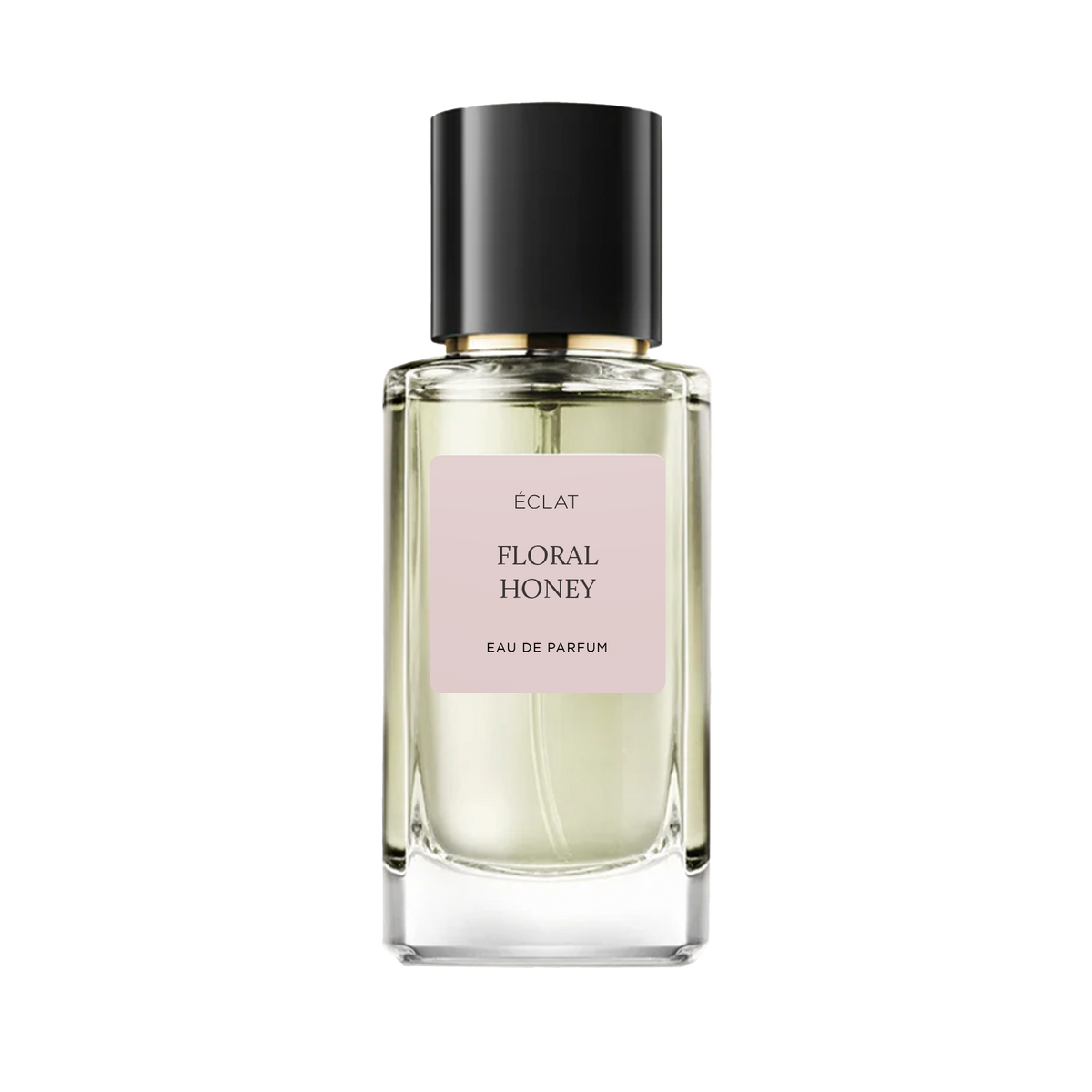 Flakon perfum ÉCLAT Floral Honey z przezroczystym fasetowanym szkłem, delikatną różową etykietą i elegancką czarną nakrętką.