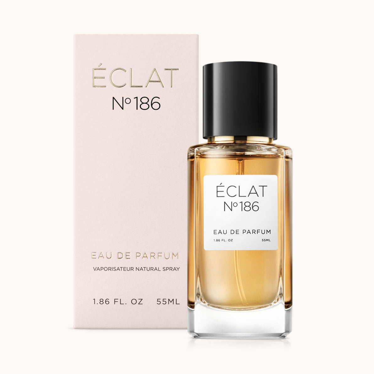 ÉCLAT No. 186 perfume bottle with matching light pink packaging. The elegant glass flacon features a black cylindrical magnetic cap and a simple white label with the inscription ÉCLAT No. 186 and “Eau de Parfum”.