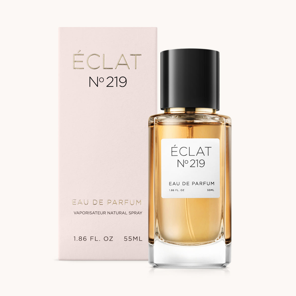 ÉCLAT No. 219 perfume bottle with matching light pink packaging. The elegant glass flacon features a black cylindrical magnetic cap and a simple white label with the inscription ÉCLAT No. 219 and “Eau de Parfum”.