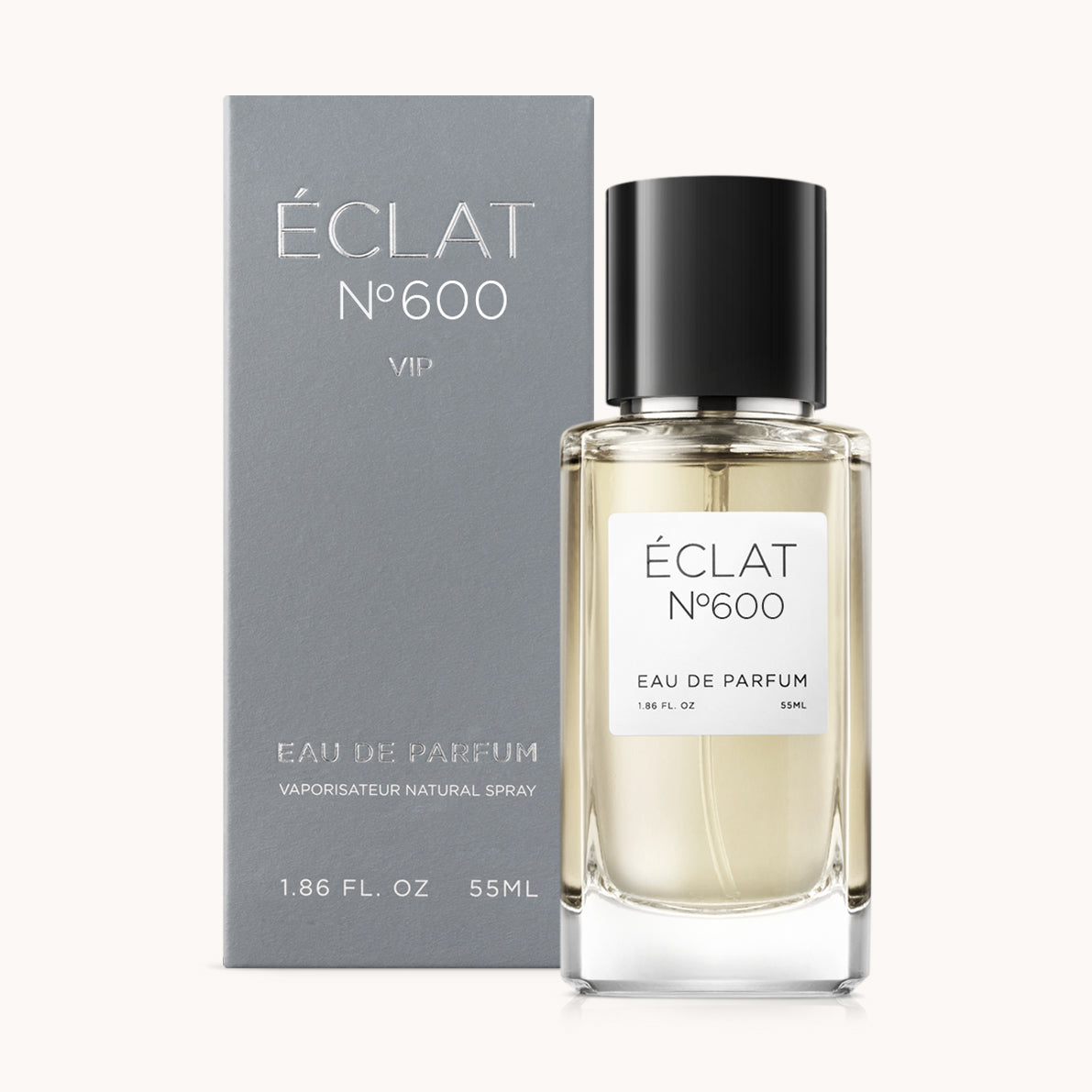 ÉCLAT No. 600 VIP men’s perfume bottle with matching bluish-grey packaging. The elegant flacon features a black cylindrical magnetic cap and a clean white label with the inscription ÉCLAT No. 600 VIP and “Eau de Parfum”.