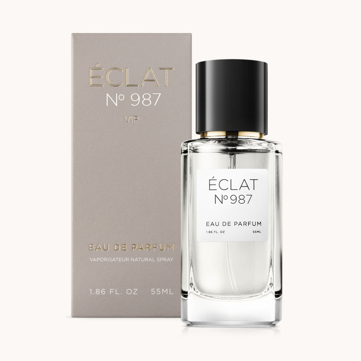 Flacon of the unisex perfume dupe ÉCLAT No. 987 VIP, an elegant transparent glass bottle with a black cylindrical magnetic cap and a minimalist white label. The label displays the brand name ÉCLAT, the number 987 VIP, and the phrase “Eau de Parfum”.