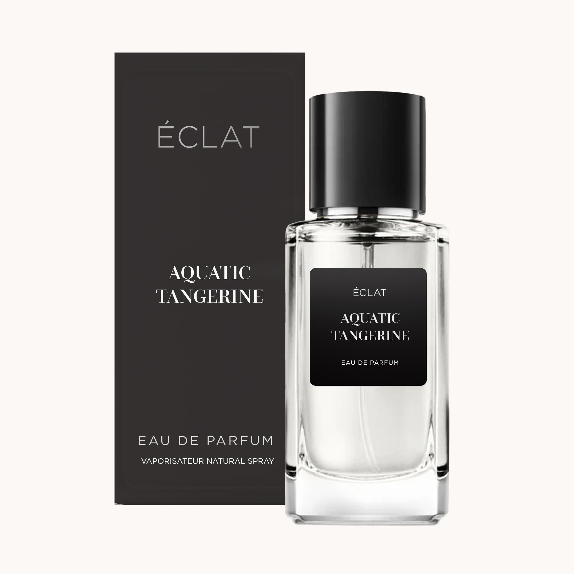 Szklany flakon perfum ÉCLAT Aquatic Tangerine z czarną zakrętką stoi obok pasującego czarnego pudełka.