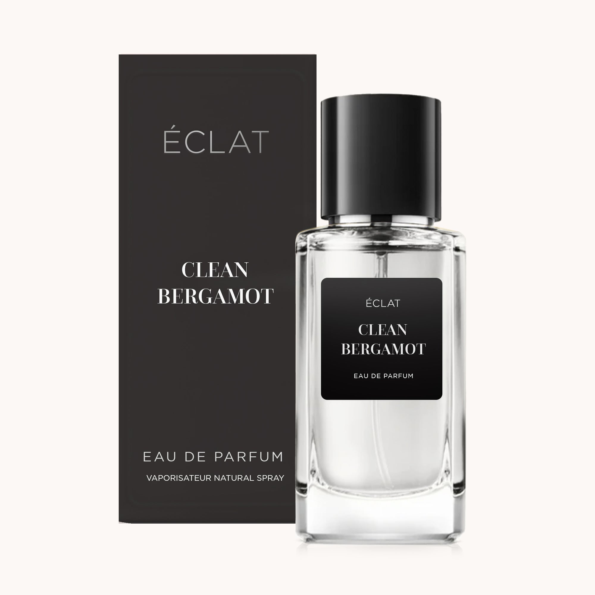 Wyrafinowana szklana butelka z czarną etykietą i dopasowanym czarnym korkiem, obok elegancko zaprojektowanego pudełka w matowej czerni, prezentująca ÉCLAT Clean Bergamot.