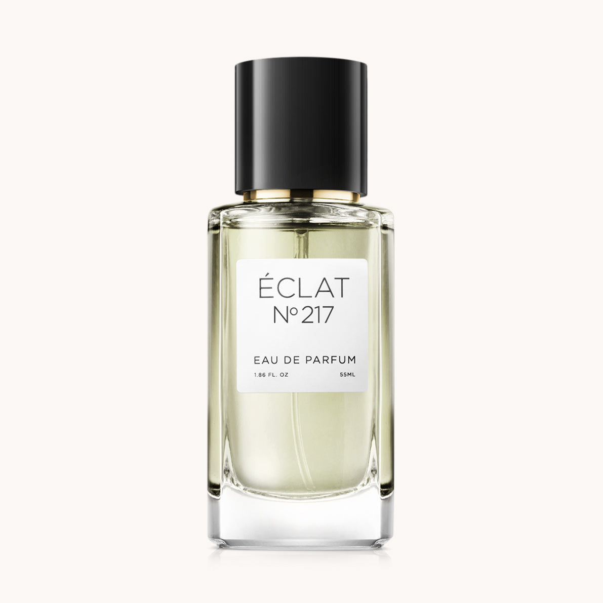 Butelka perfum ÉCLAT Floral Honey z przezroczystym fasetowanym szkłem i czarną nakrętką.