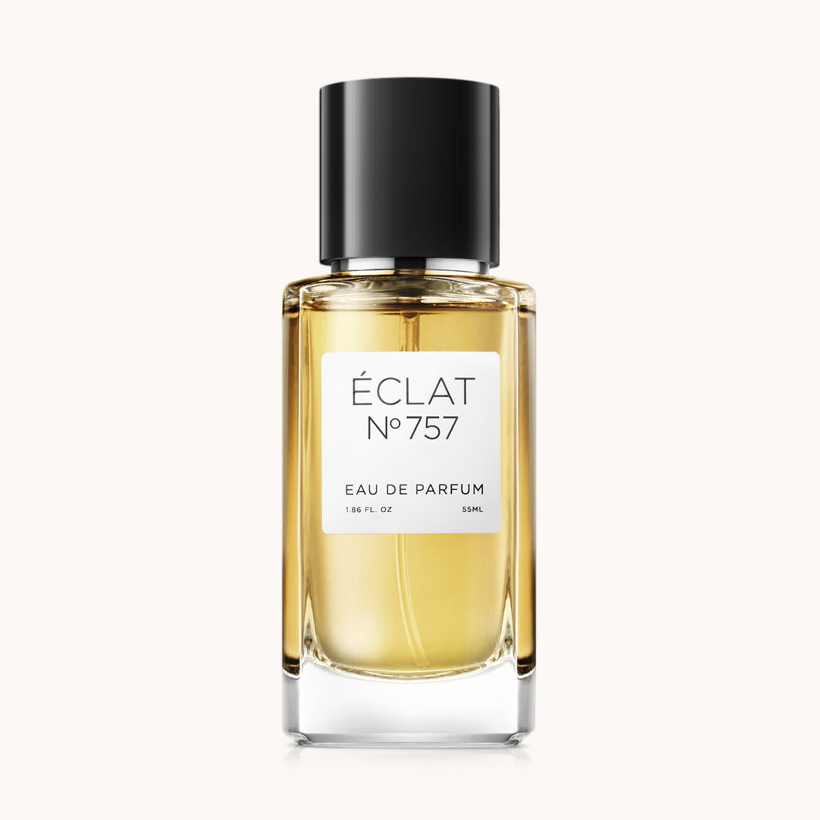 Elegancki szklany flakon ÉCLAT Mint & Tonka Bean z czarną nakrętką i białą etykietą.