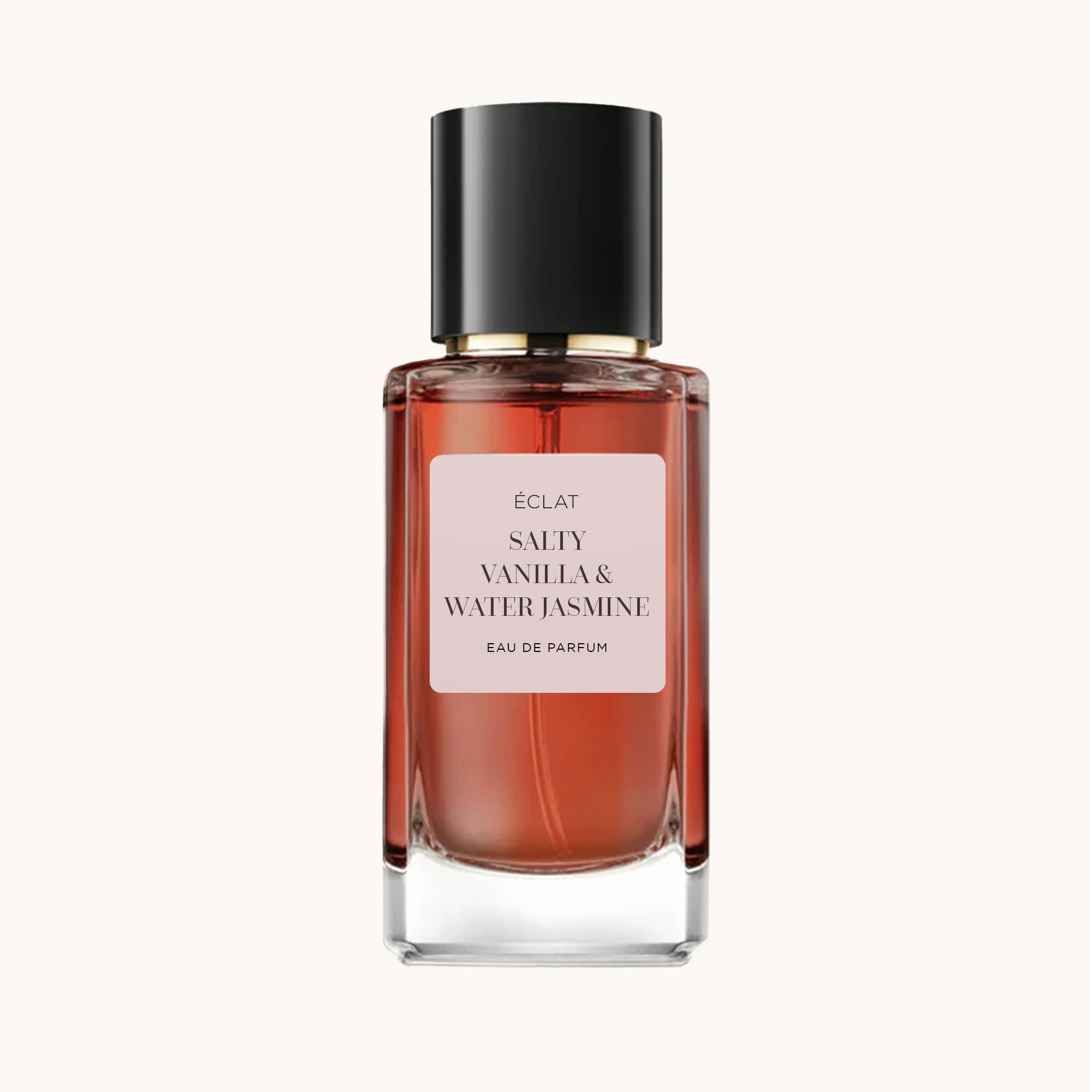 ÉCLAT Salty Vanilla & Water Jasmine w fasetowanej szklanej butelce z czarną nakrętką.