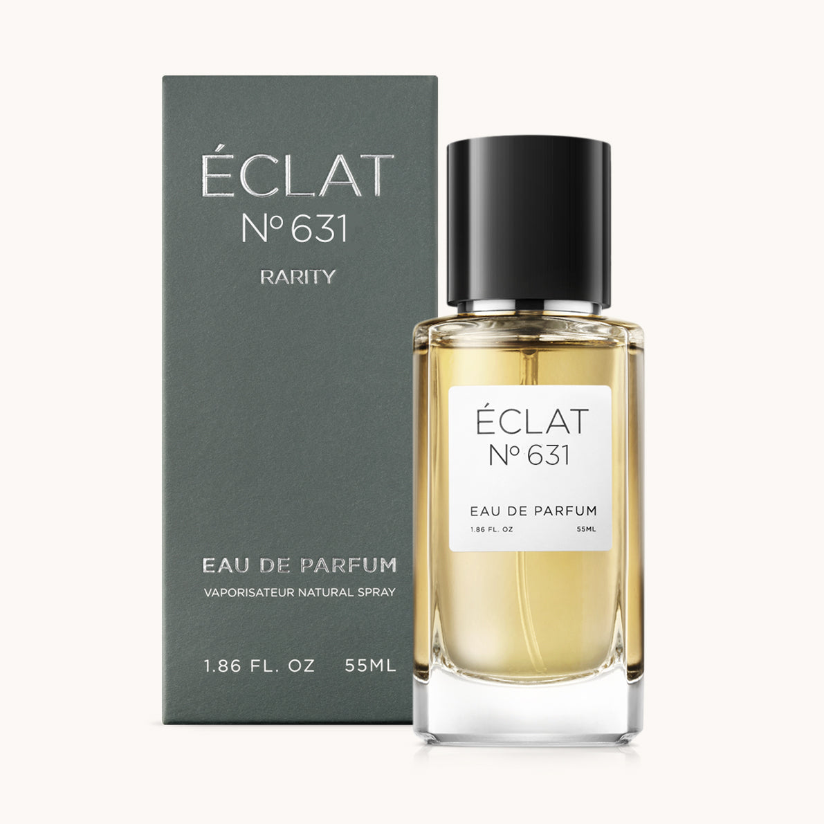 Perfumy ÉCLAT Spicy Blood Orange z przezroczystą szklaną butelką i czarną nakrętką, obok ciemnego, matowego pudełka.