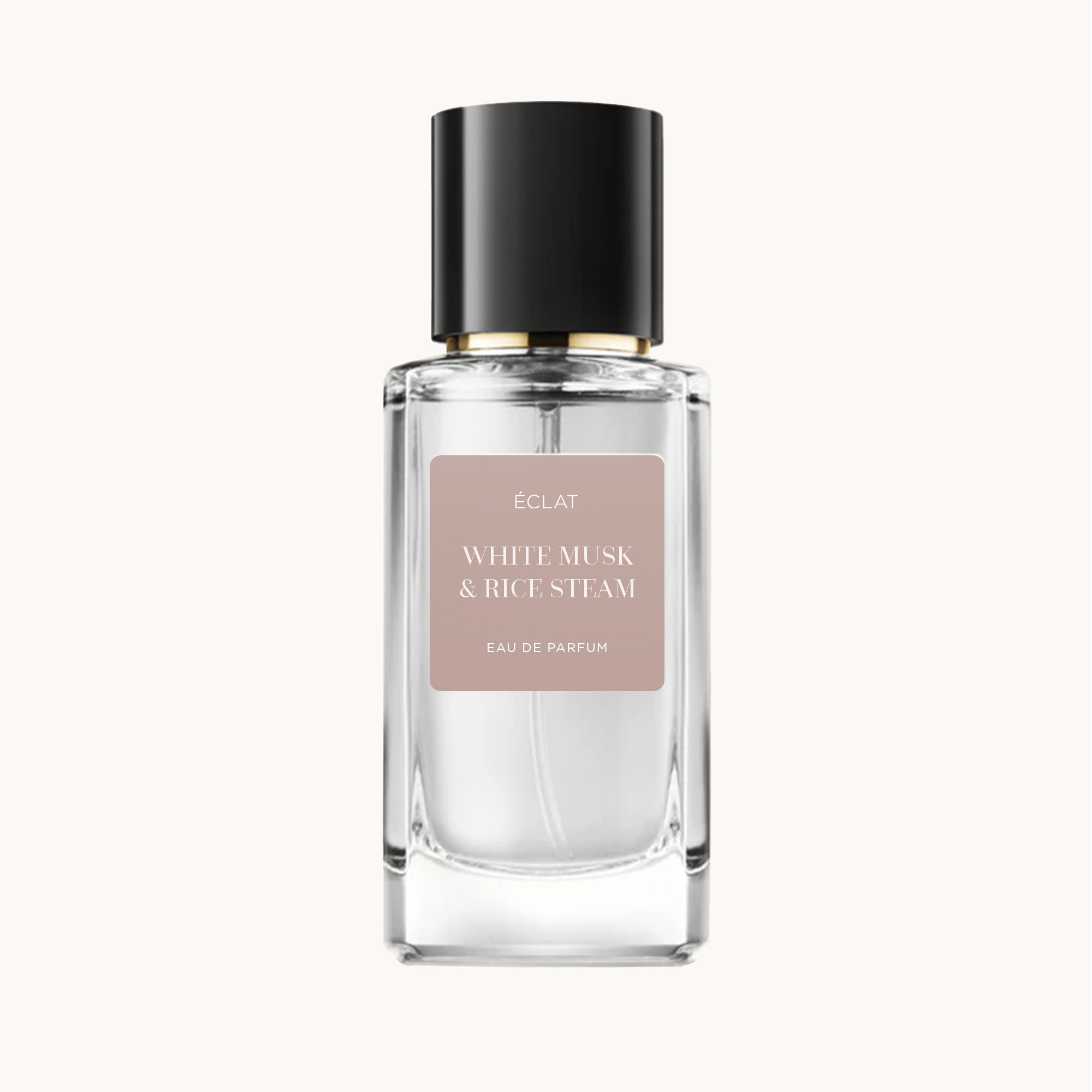 Fasadowa szklana butelka ÉCLAT White Musk & Rice Steam z czarną nakrętką i matową etykietą.