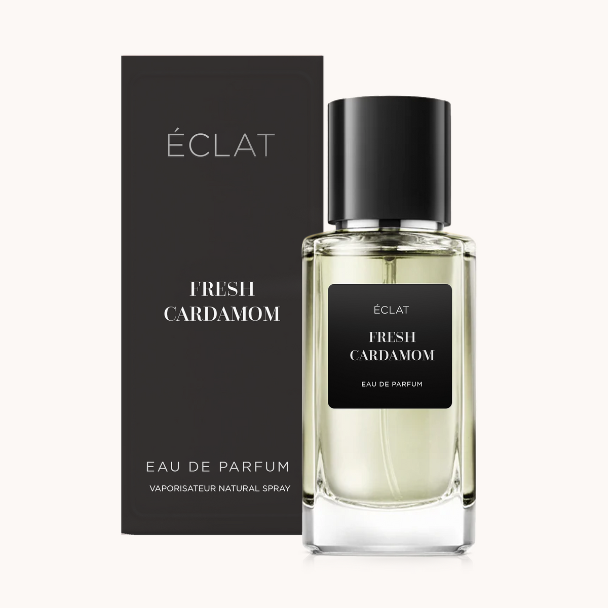 Flakon perfum ÉCLAT Fresh Cardamom z czarną etykietą i korkiem, obok pasującego czarnego pudełka.