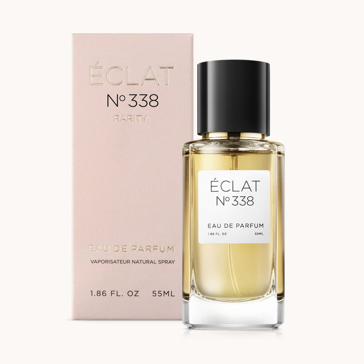 Elegancki flakon perfum ÉCLAT Amber & Spices z czarną zakrętką, obok różowego pudełka.