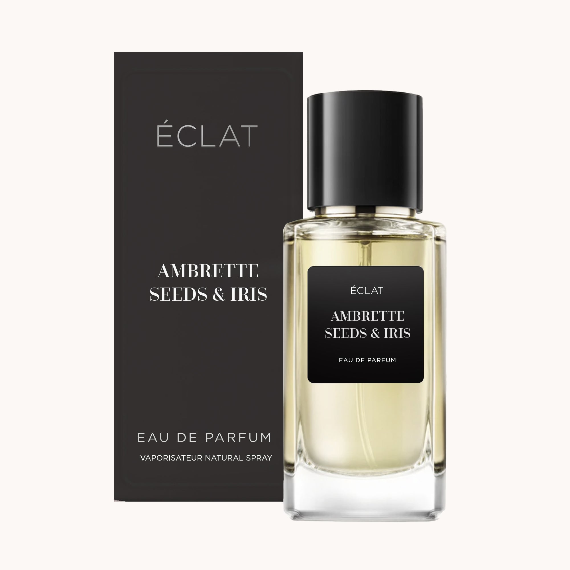 Perfumy ÉCLAT Ambrette Seeds & Iris w szklanym flakonie o fasetowanej powierzchni z czarną nakrętką, w eleganckim, pasującym pudełku.