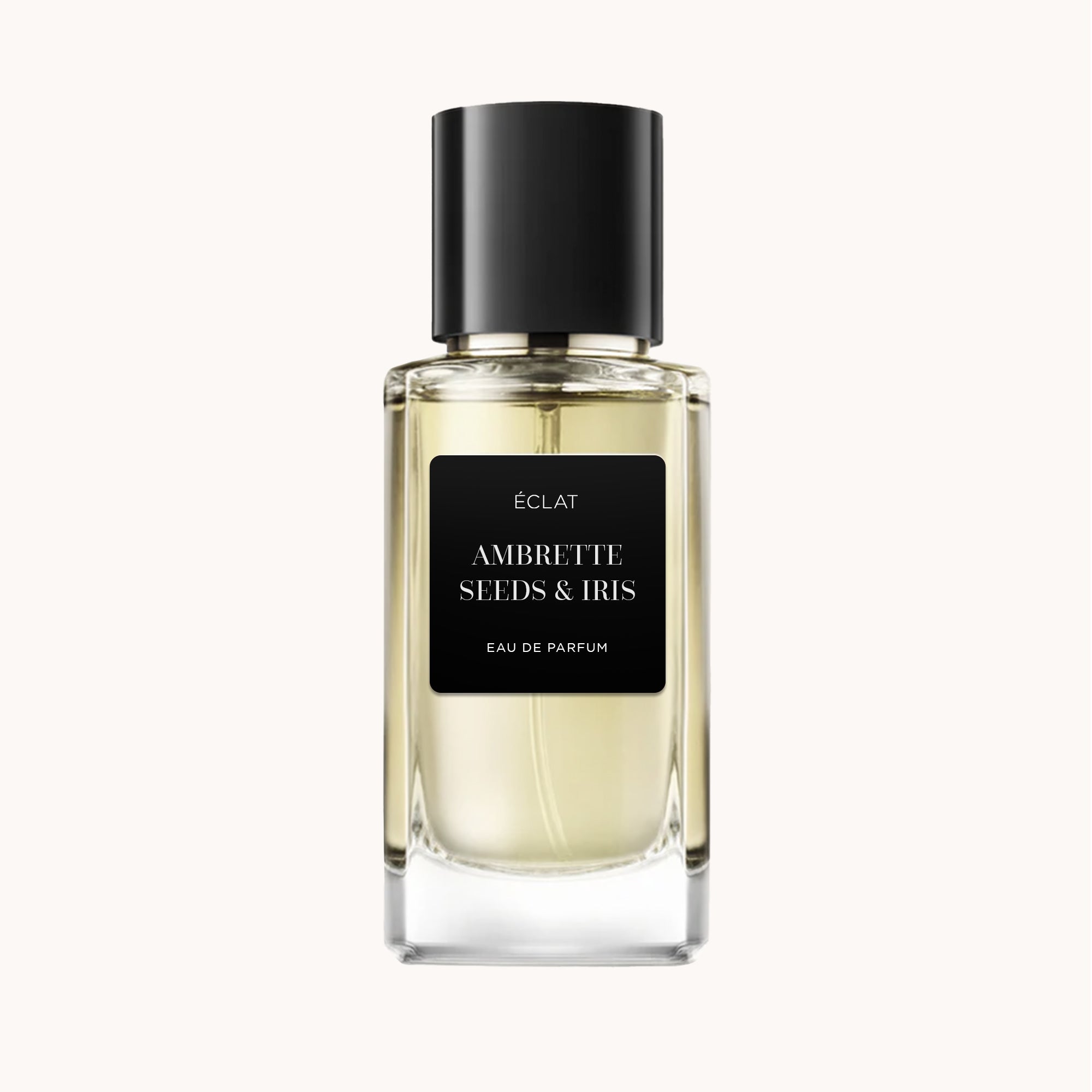 Perfumy ÉCLAT Ambrette Seeds & Iris w przezroczystej szklanej butelce z czarną nakrętką i matową czarną etykietą.