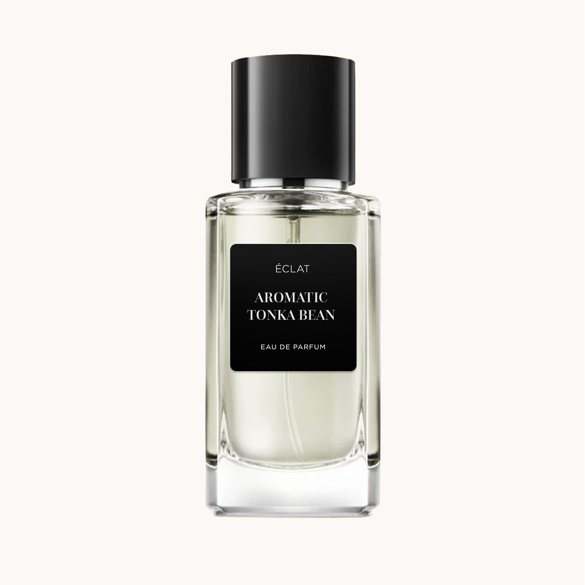 ÉCLAT Aromatic Tonka Bean w przezroczystym, fasetowanym szklanym flakonie z czarną matową nakrętką i etykietą.