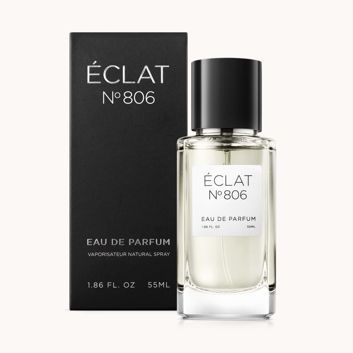 Zapach ÉCLAT Citron & Ginger w fasetowanej szklanej butelce z czarnym korkiem, w towarzystwie eleganckiego czarnego opakowania.