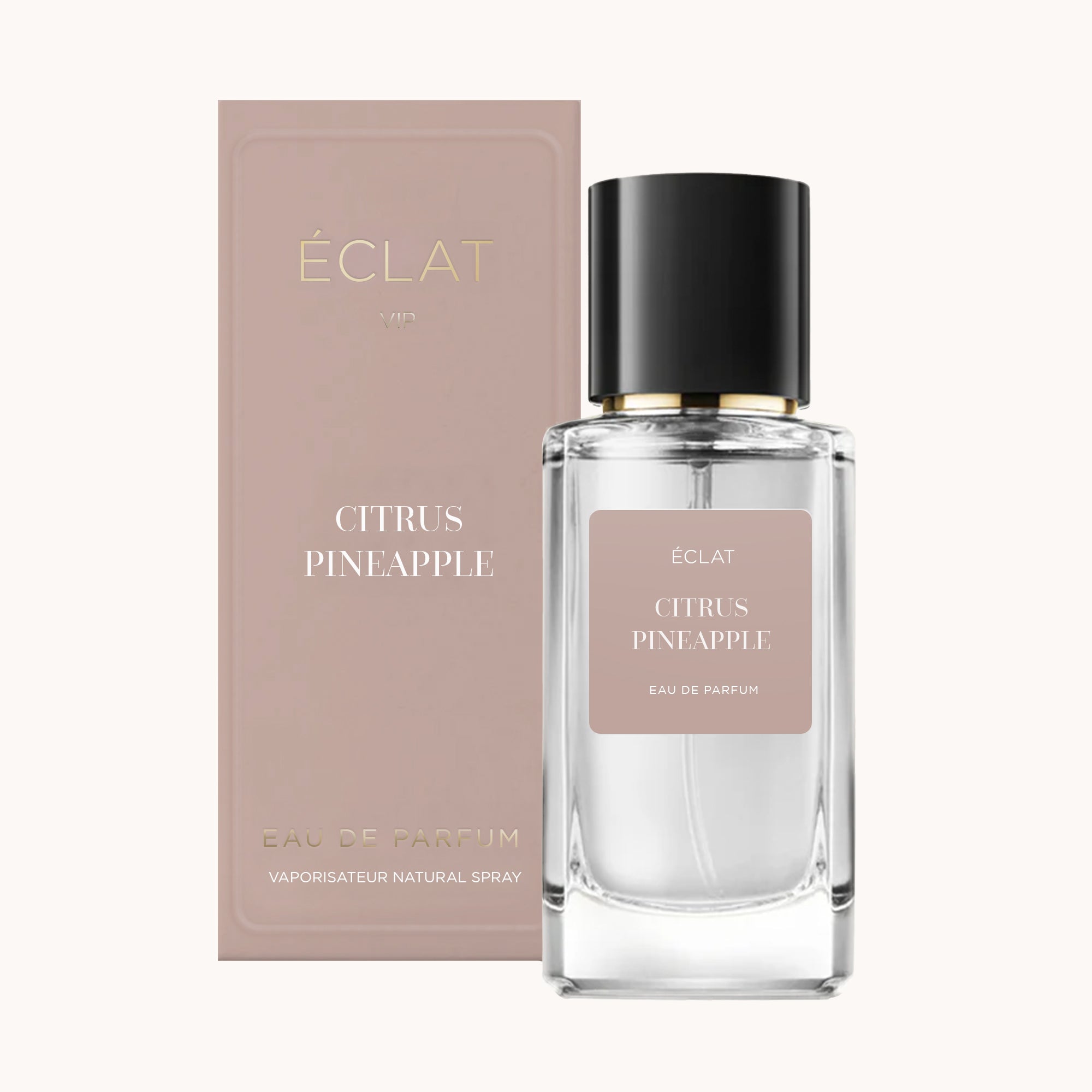 Fasetowany szklany flakon ÉCLAT Citrus Pineapple z czarną nakrętką, obok pasującego beżowego pudełka.