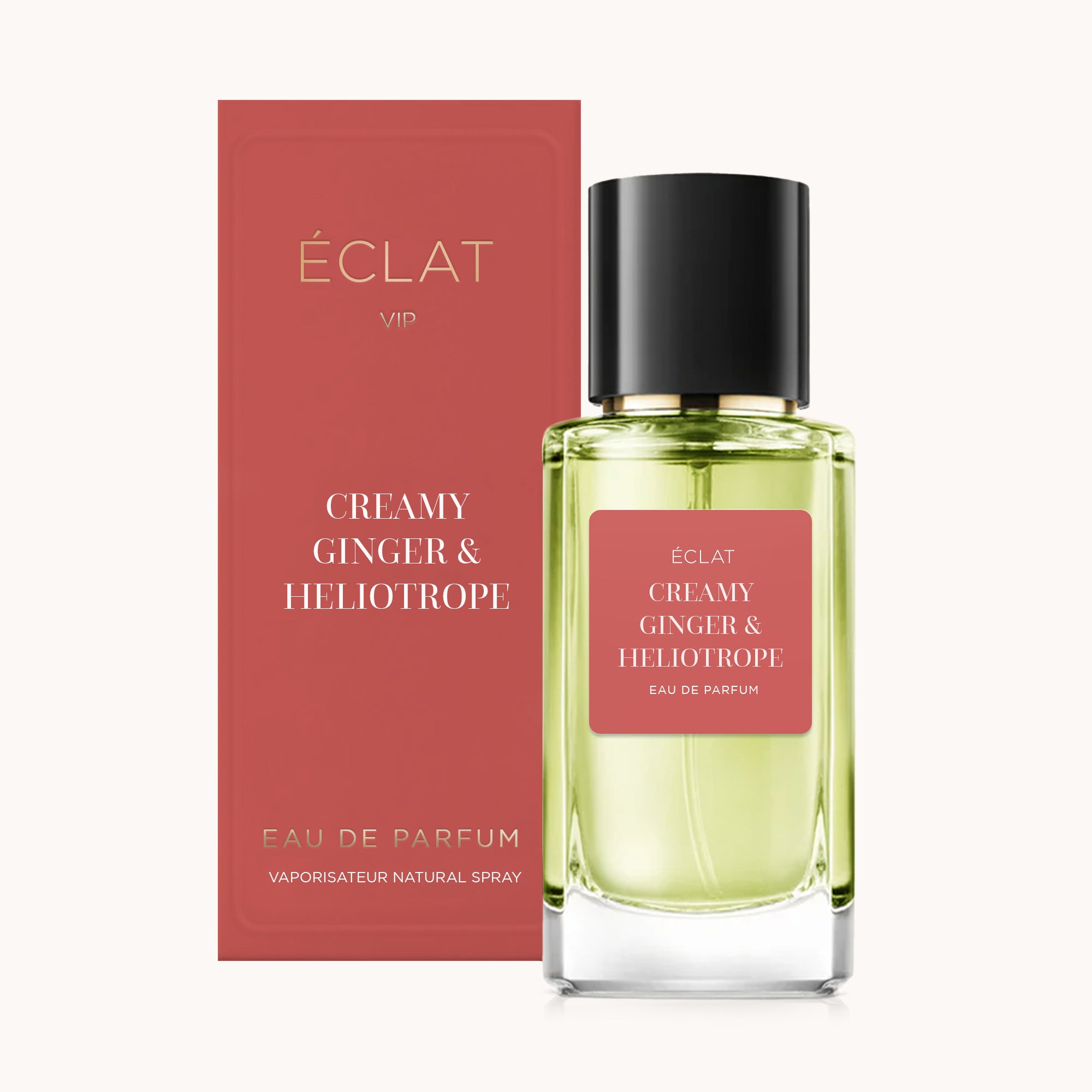 Fasetkowany szklany flakon z czarną nakrętką i czerwoną etykietą ÉCLAT Creamy Ginger & Heliotrope, obok pasującego czerwonego pudełka.