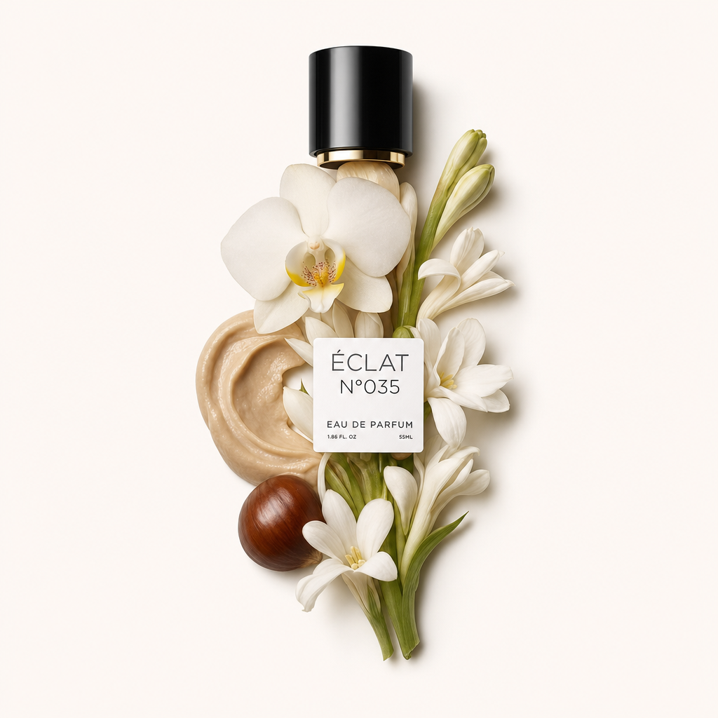 Kompozycja kremowej tekstury, białych kwiatów tuberozy i orchidei otacza czarną nasadkę z etykietą ÉCLAT Creamy Tuberose.