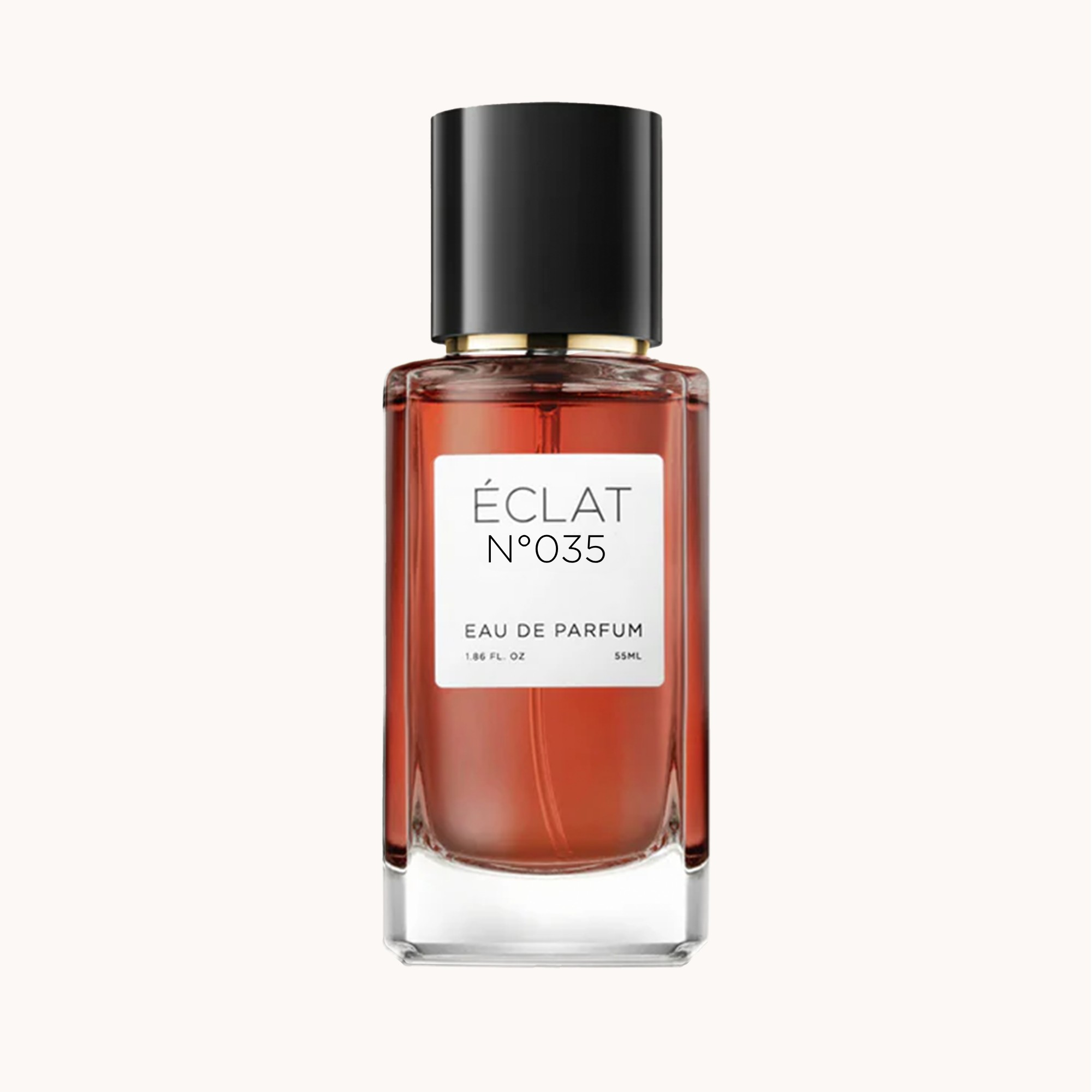 Fasetkowany flakon szklany z czarną nakrętką, zawierający ÉCLAT Creamy Tuberose, z białą etykietą.