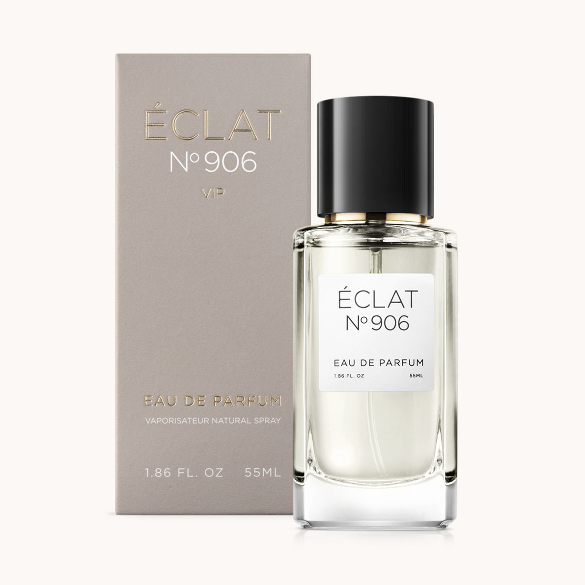 Wyrafinowany szklany flakon ÉCLAT Creamy Ylang-Ylang z czarną nakrętką, w towarzystwie eleganckiego szarego pudełka.