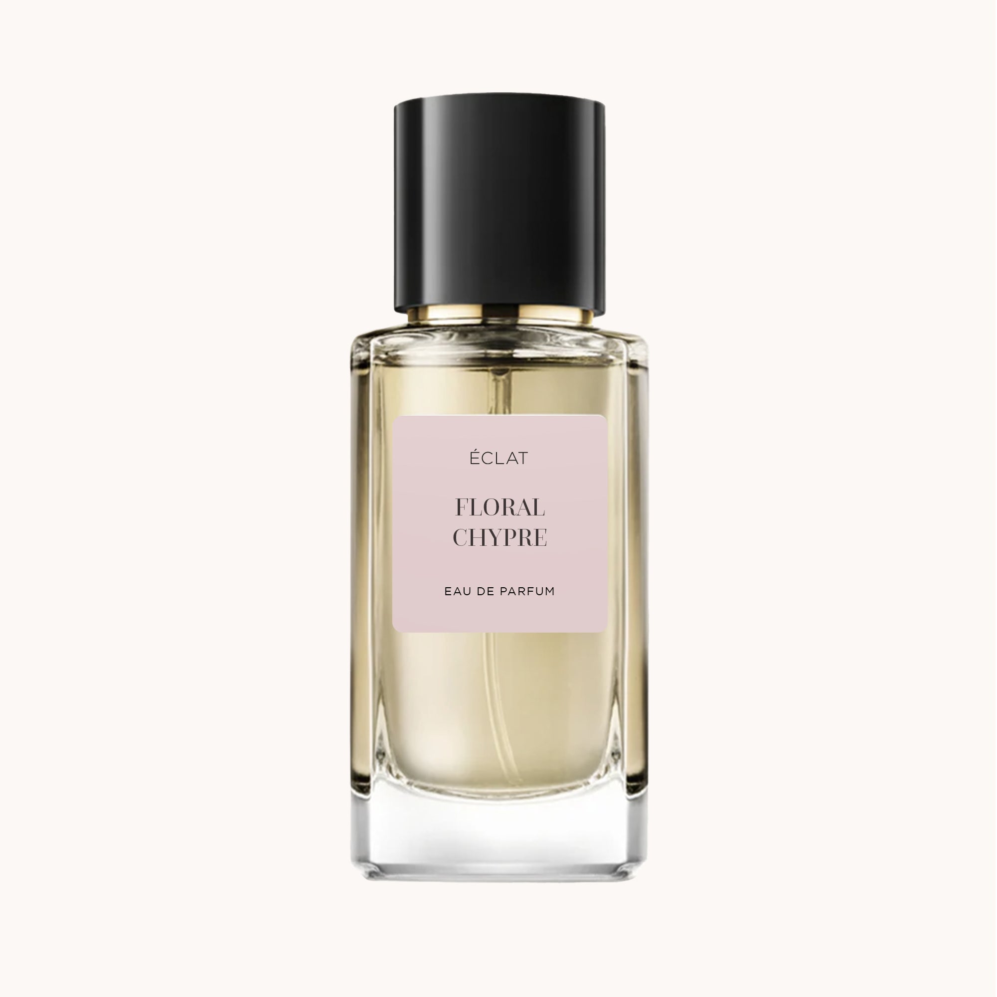 Flakon perfum ÉCLAT Floral Chypre ma transparentny szklany design z bladym różowym etykietą i elegancką czarną nakrętką.