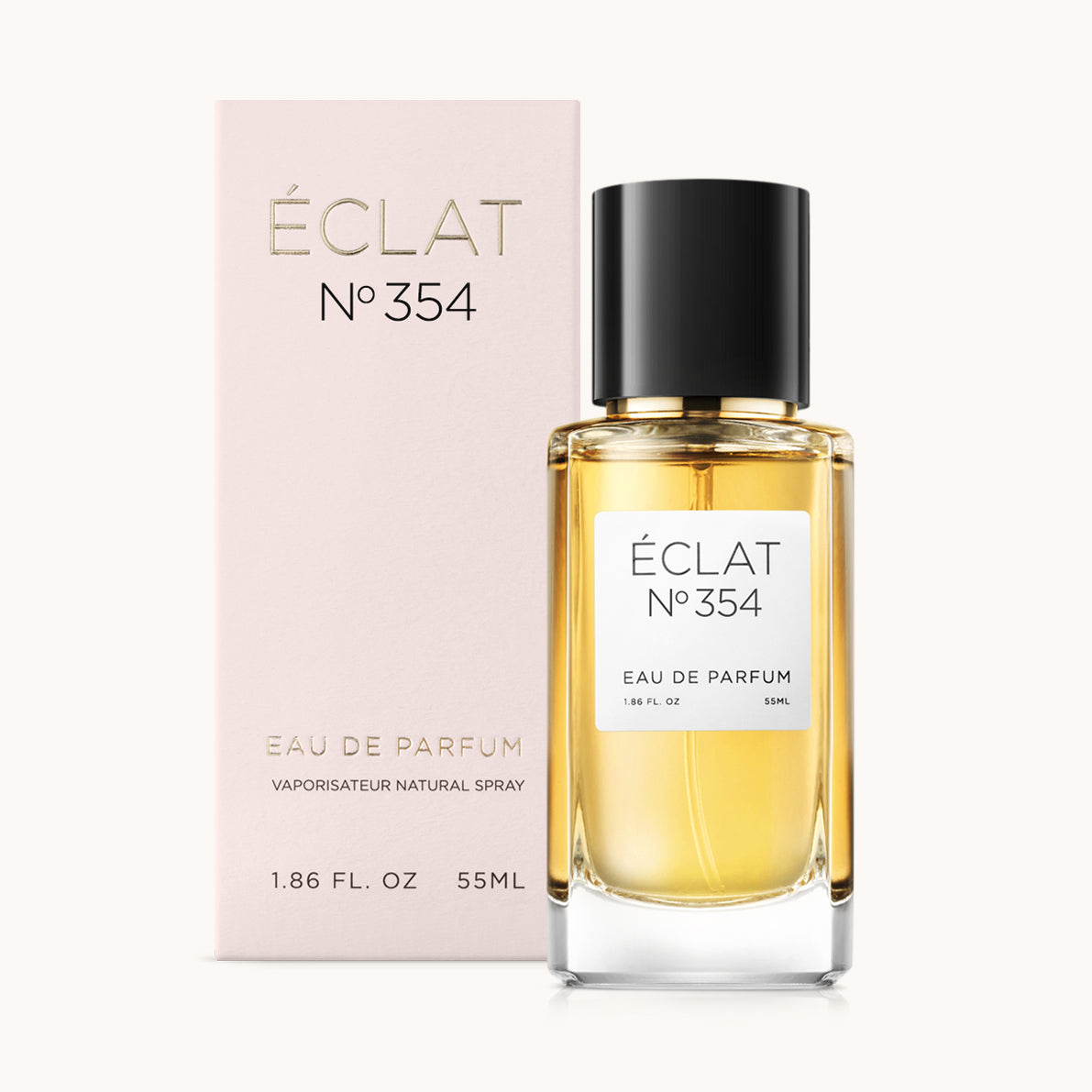 Flakon perfum ÉCLAT Floral Ginger z czarną zakrętką i jasnoróżowym pudełkiem.