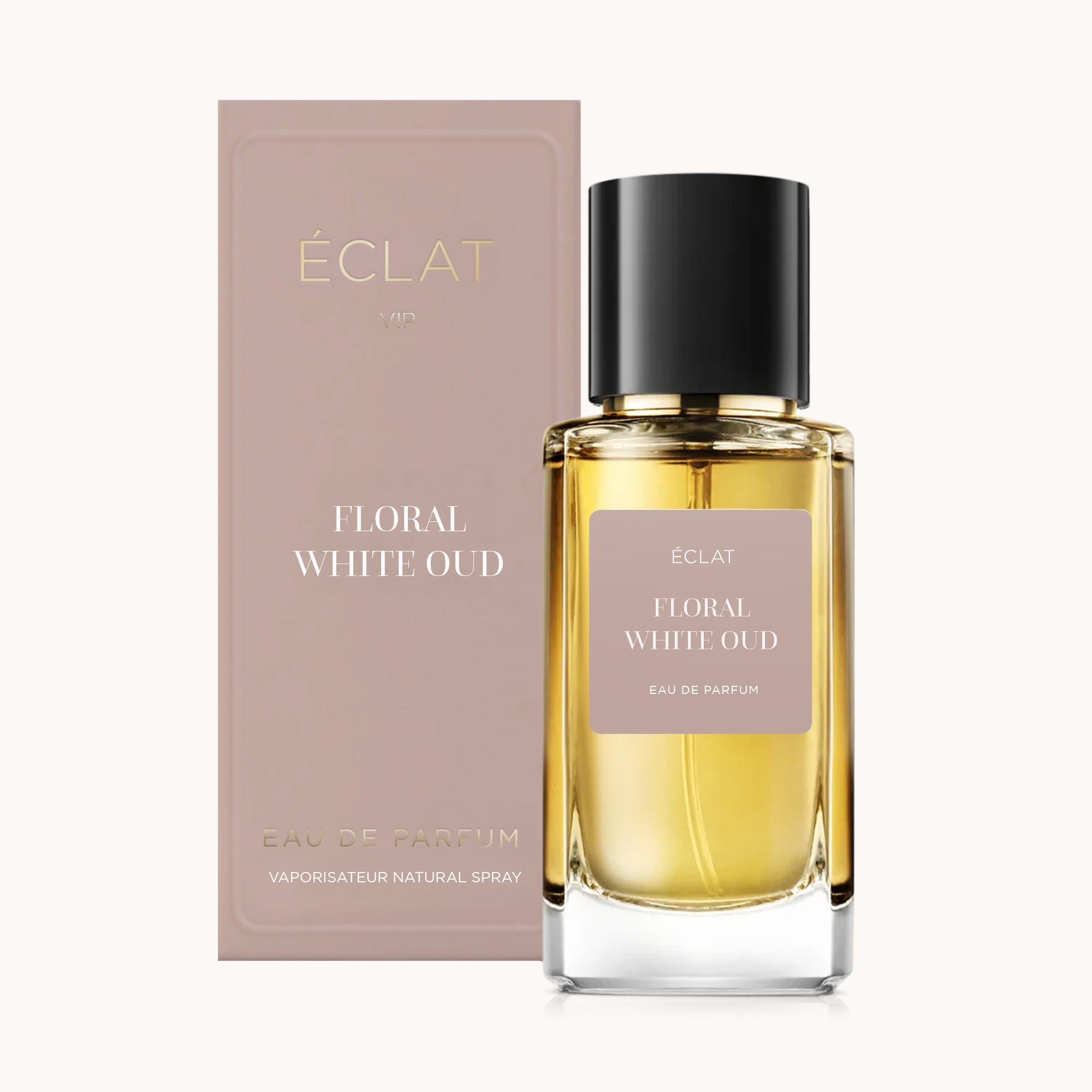 ÉCLAT Floral White Oud w przezroczystej szklanej butelce z czarną nakrętką, obok taupe pudełka.