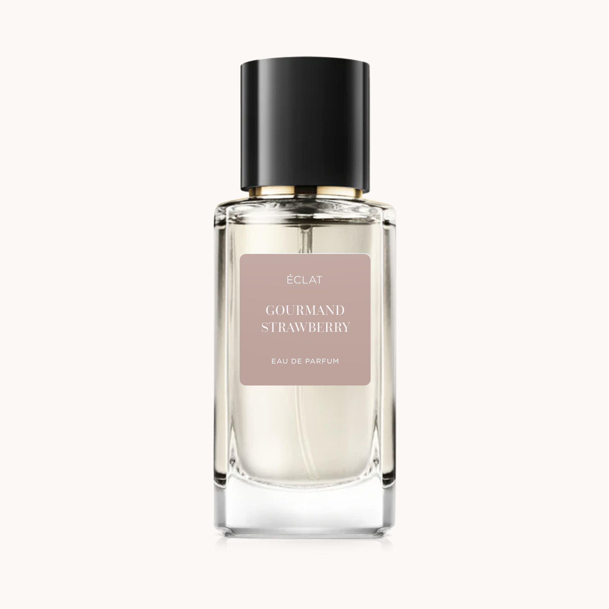 Perfumy ÉCLAT Gourmand Strawberry w szklanym flakonie z czarną nakrętką i matową etykietą.