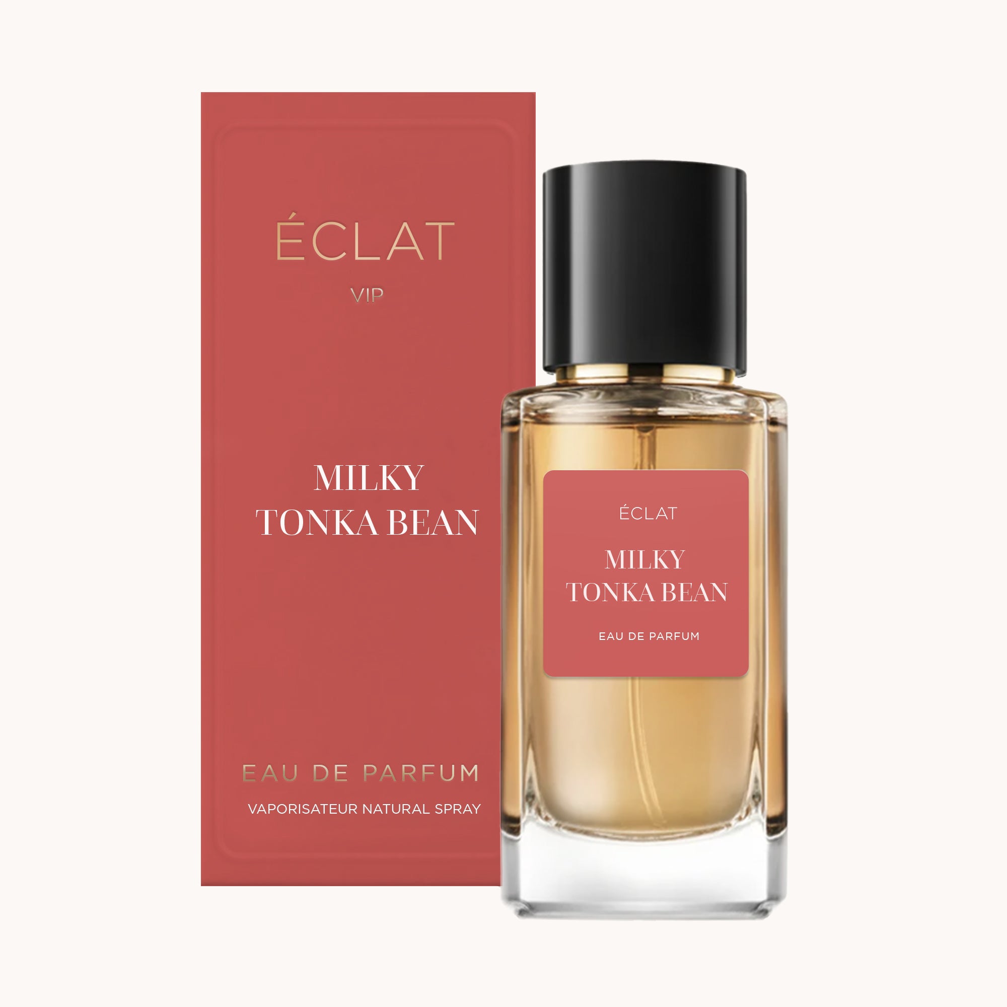 ÉCLAT Milky Tonka Bean VIP w fasetowanej szklanej butelce z czarną nasadką, w towarzystwie czerwonego pudełka prezentacyjnego.