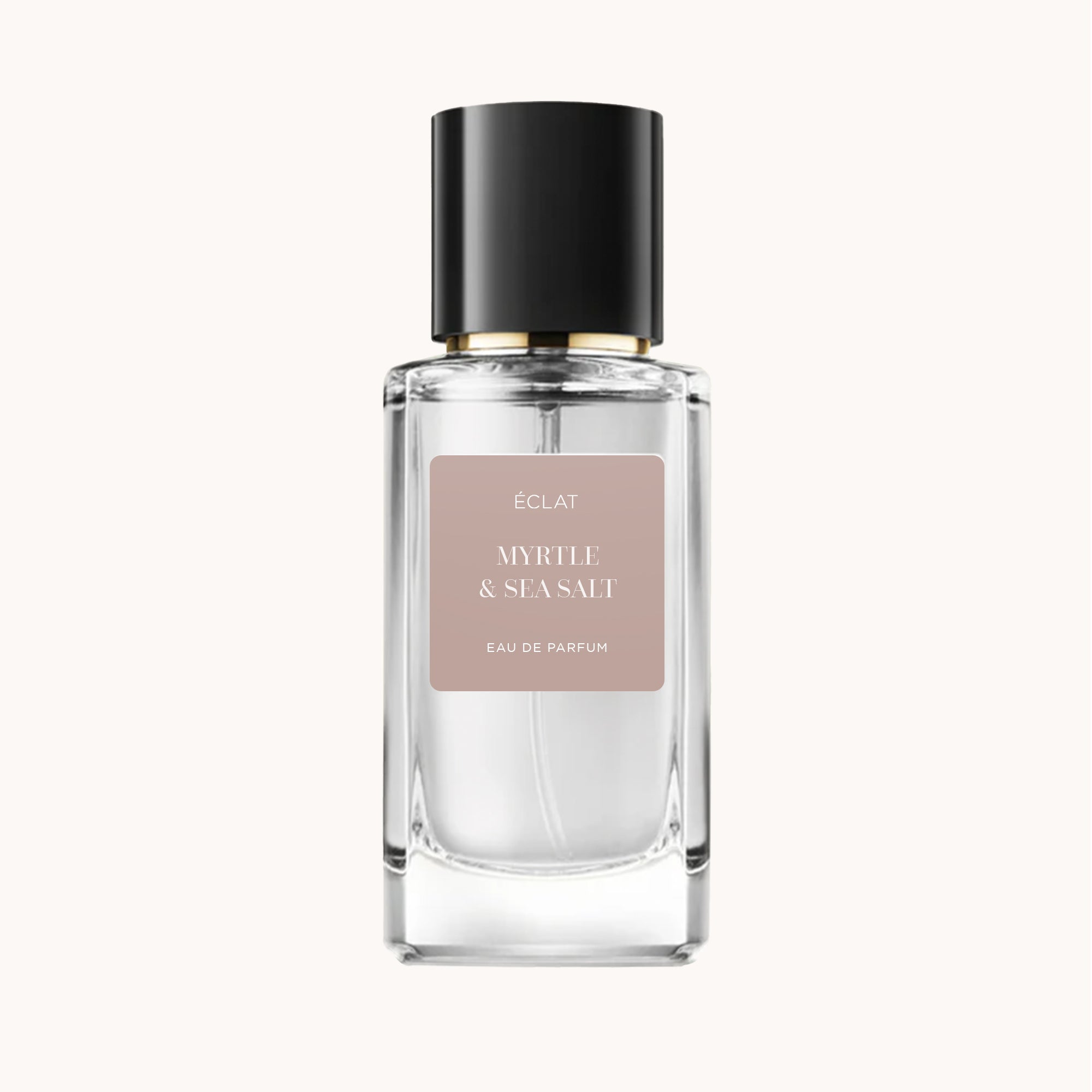 Fasetkowana szklana butelka ÉCLAT Myrtle & Sea Salt z czarną nakrętką i stonowaną beżową etykietą.