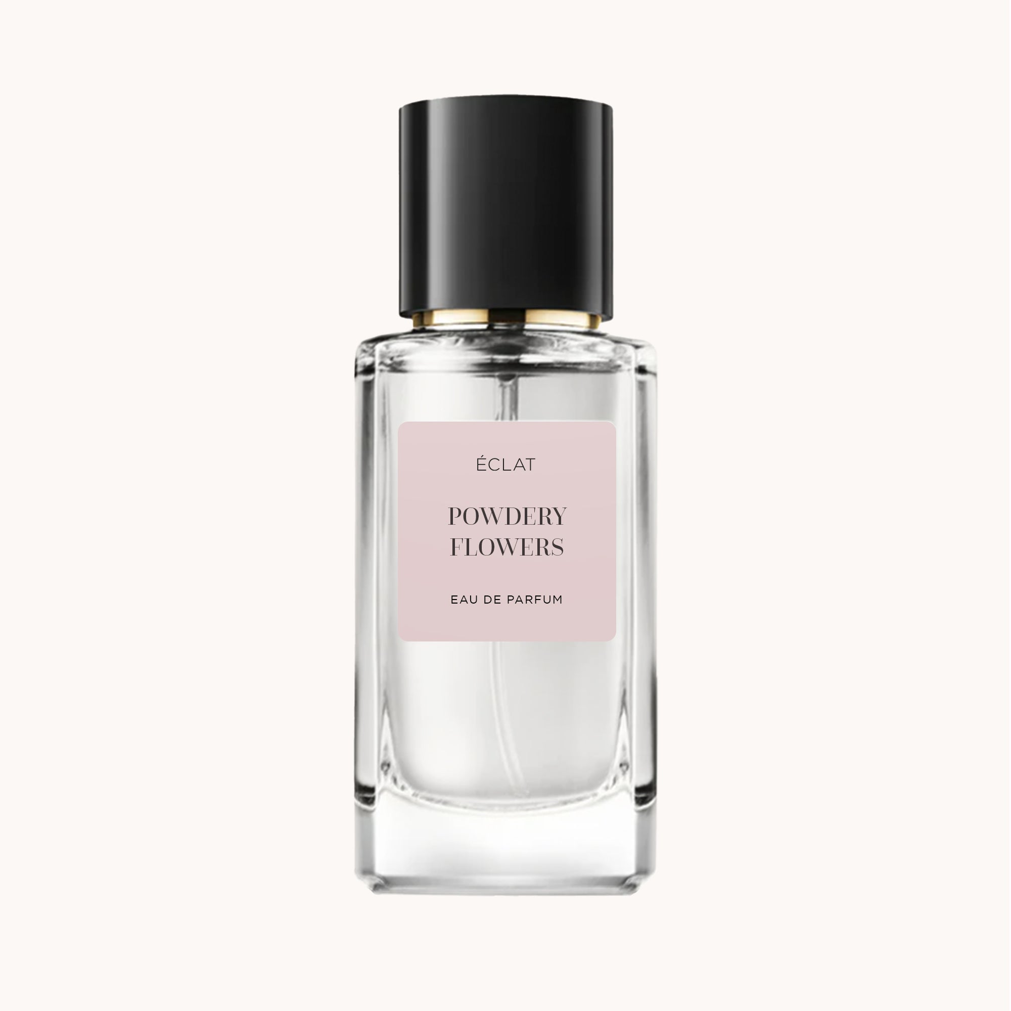 ÉCLAT Powdery Flowers w przezroczystej szklanej butelce z czarną nakrętką i różową etykietą.