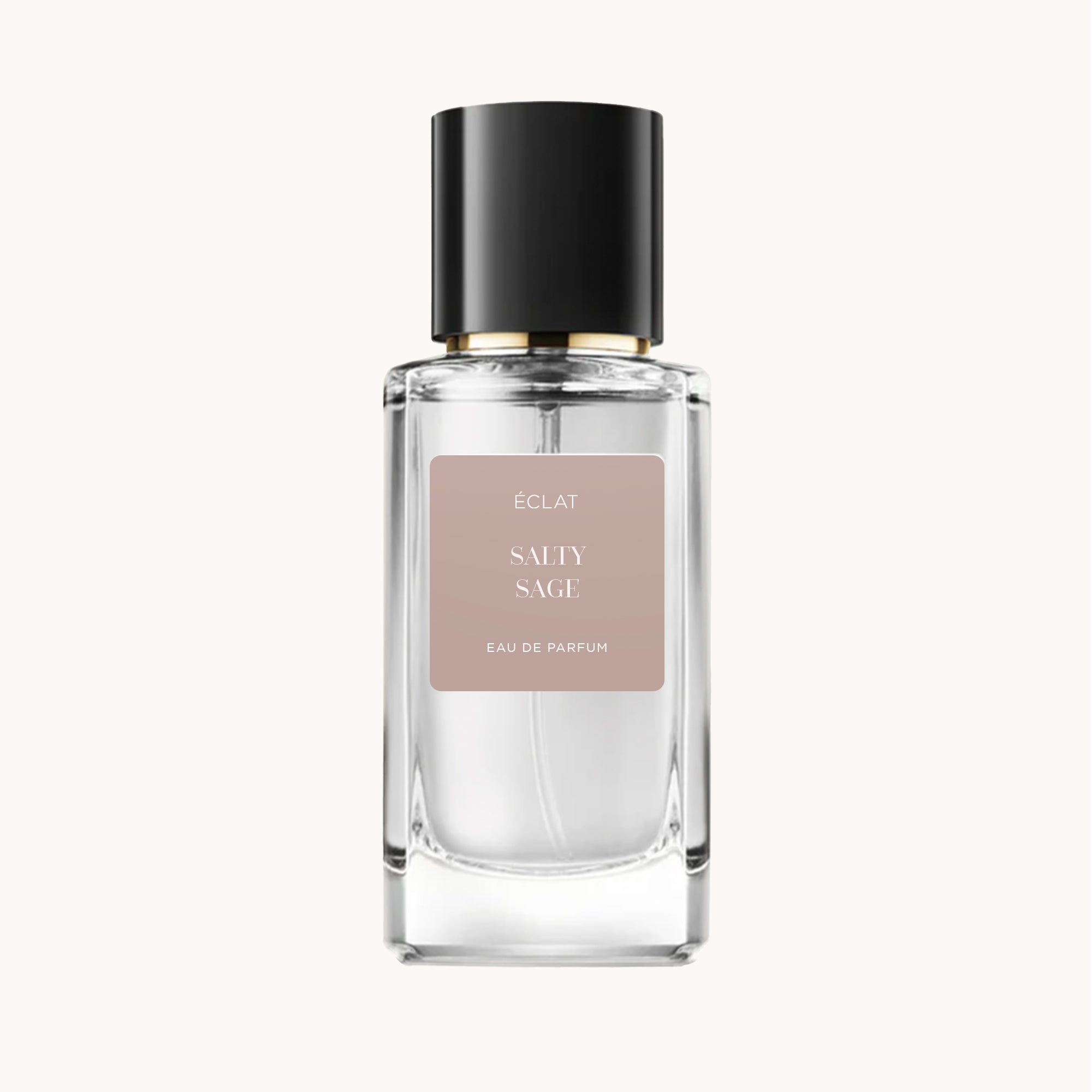Przezroczysta, fasetowana butelka szklana perfum ÉCLAT Salty Sage z czarną nakrętką i beżową etykietą.