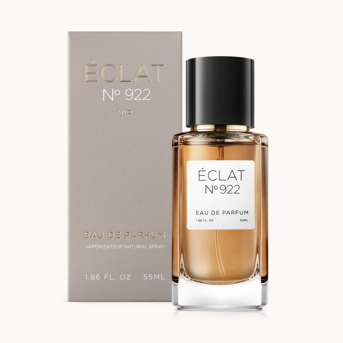 Perfumy ÉCLAT Smoky Cherry w eleganckiej szklanej butelce z czarną nakrętką, w towarzystwie eleganckiego szarego pudełka.