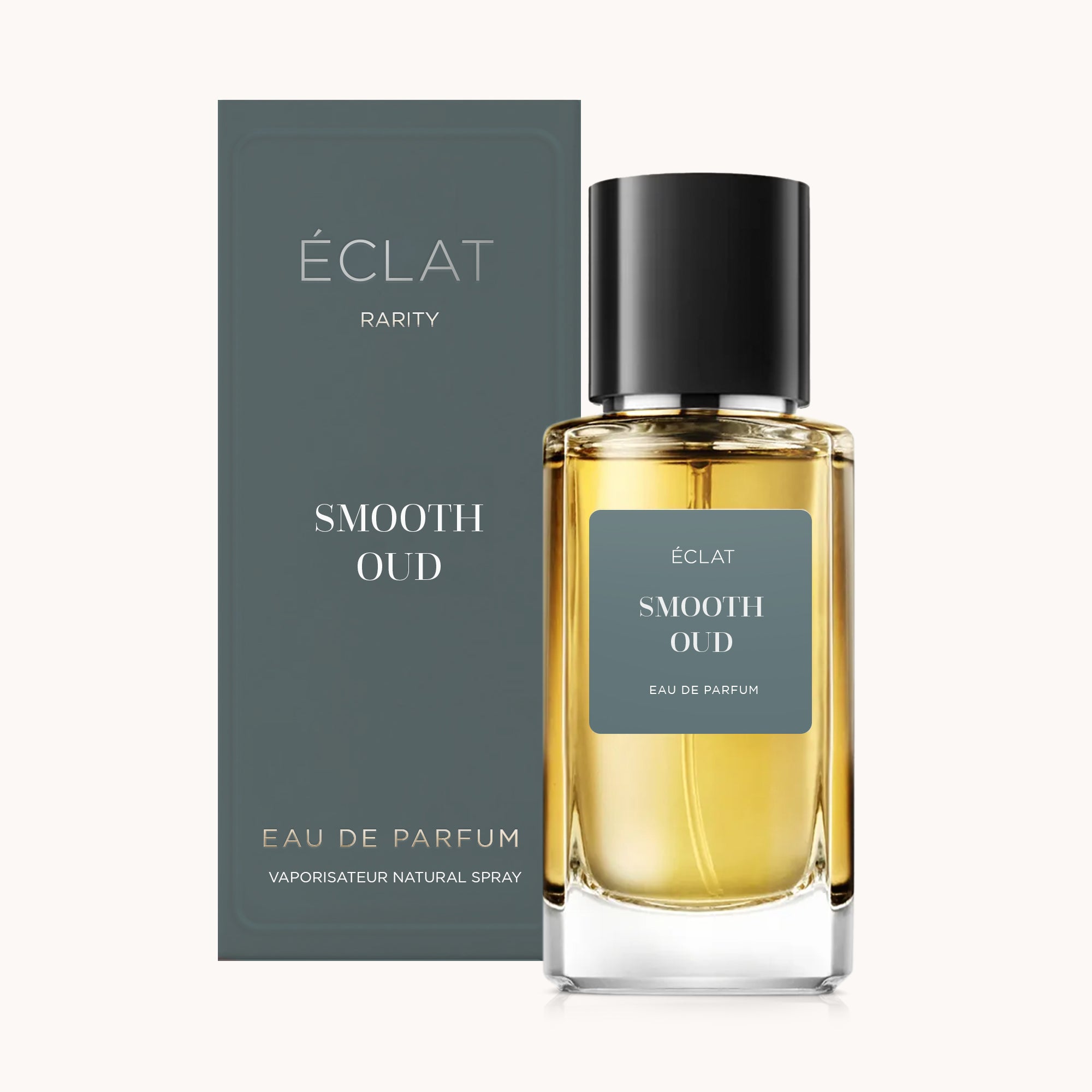 Flakon perfum ÉCLAT Smooth Oud z czarnym korkiem, w towarzystwie eleganckiego szarego pudełka.