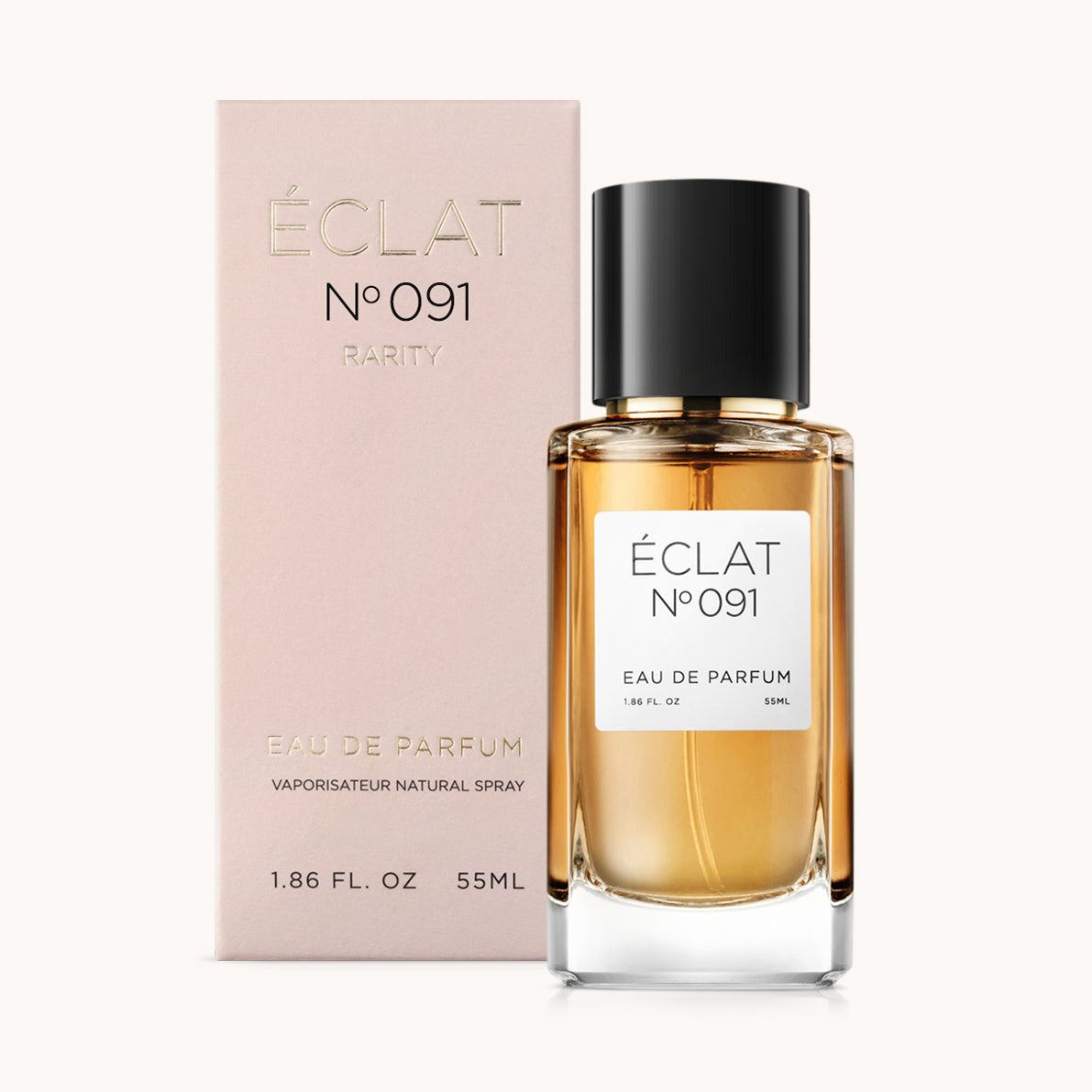 Flakon perfum ÉCLAT Sweet Amaretto z czarną nakrętką i bladoróżowym pudełkiem obok.