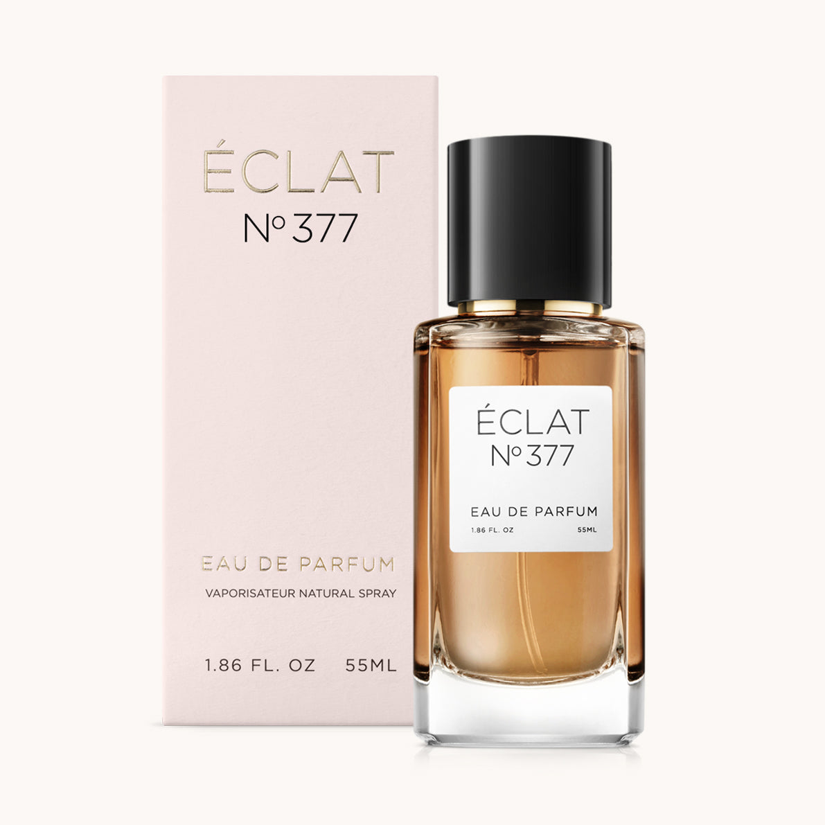 ÉCLAT Vanilla & Popcorn w fasetowanej szklanej butelce z czarną nakrętką, umieszczone przed miękkim różowym pudełkiem.