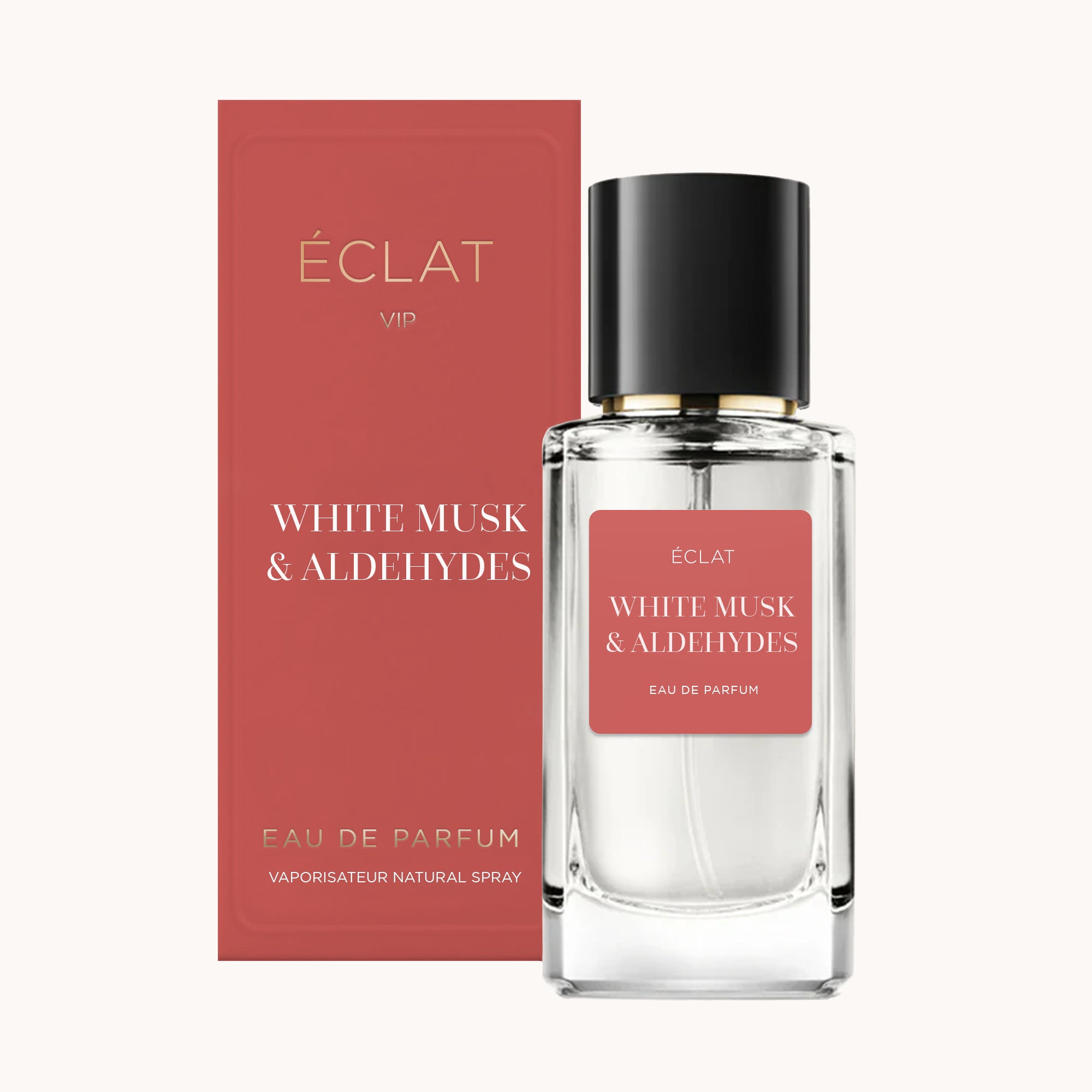 Elegancka szklana butelka ÉCLAT White Musk & Aldehydes z czarną nakrętką, obok czerwonego pudełka ze złotymi akcentami.
